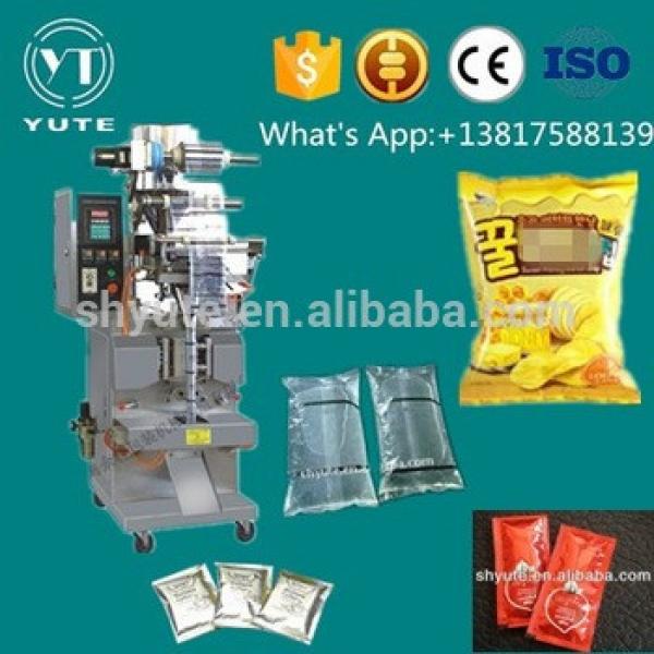 Automatic snack plastic bag nitrogen sealing machine for small business #1 image